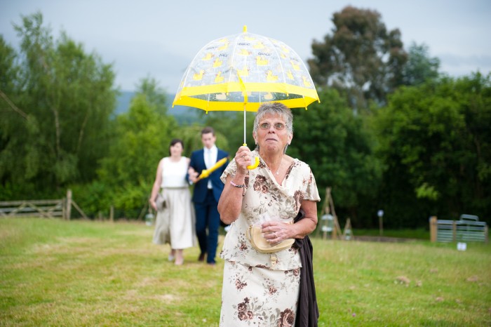 Wedding guest with umbrella