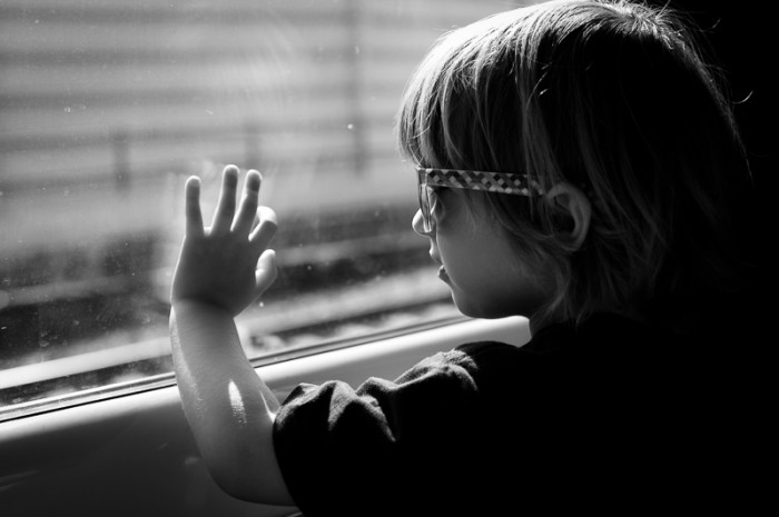 Child looking out of train window in Berlin