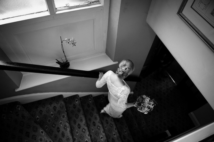 Bride walking down the stairs at Dean Place Hotel