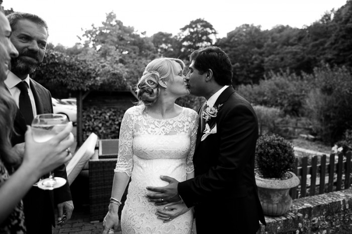 Bride and Groom kissing during wedding at Deans Place