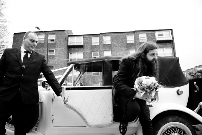 Groom arriving at Crocker's Folly wedding in vintage car
