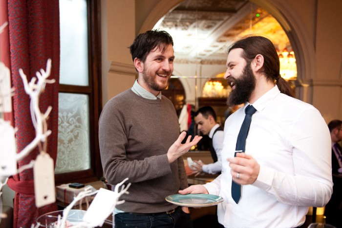 Groom laughing with guest at Crocker's Folly in St Johns Wood