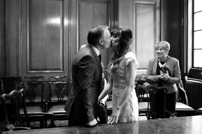 Bride and groom kissing at Camden Hall