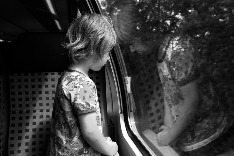 Boy travelling on train