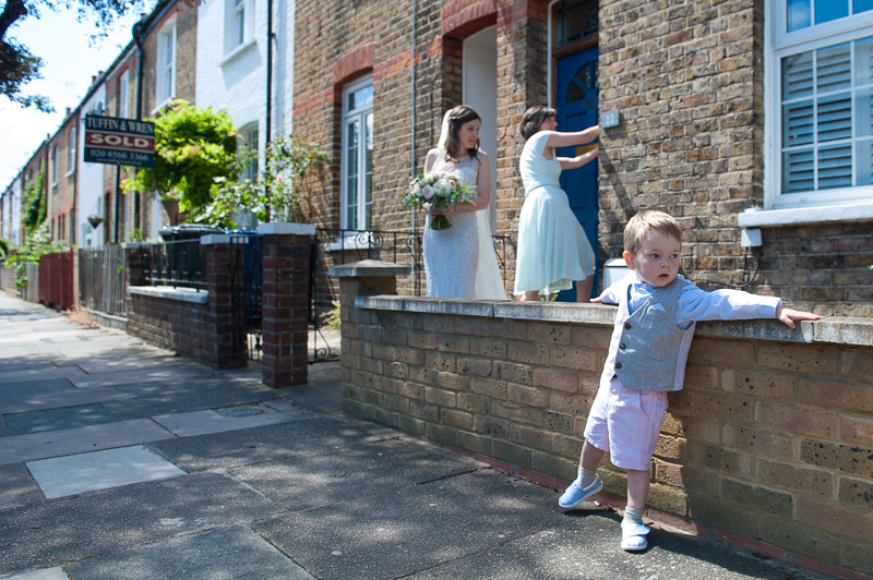 Bride leaves house to go to wedding ceremony in Ealing