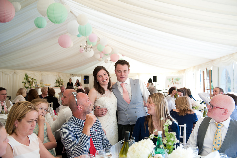 Bride and groom mingle during wedding reception at Ham House