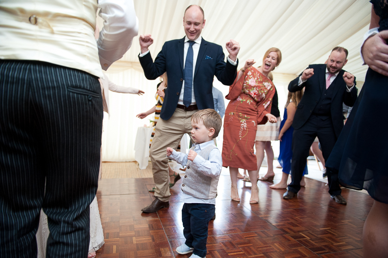 Candid wedding photo of guests dancing at Ham House wedding