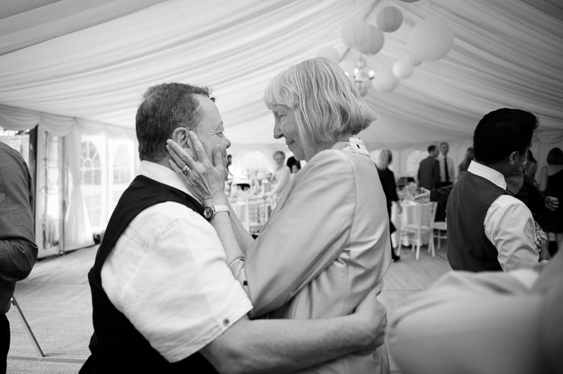 Documentary wedding photograph of guests dancing at Ham House