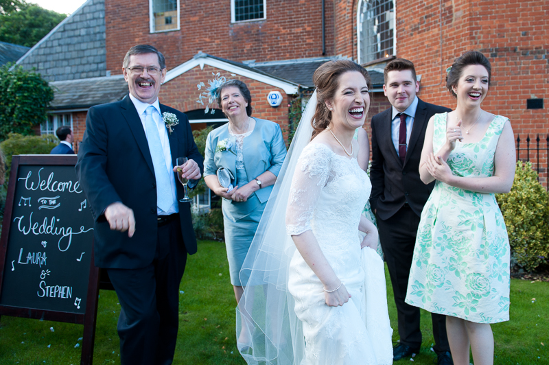 Bride laughing in the garden at Kings Chapel in Amersham