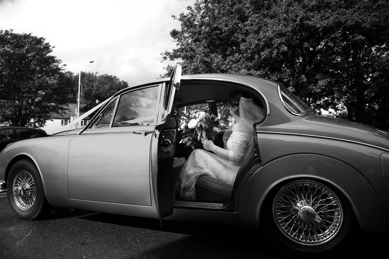 Bride arrives in vintage car in Uxbridge