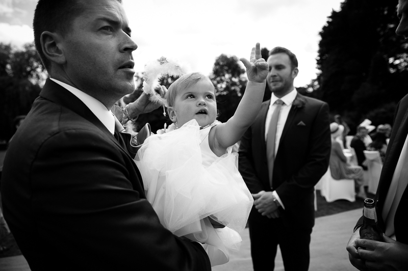 Reportage wedding photo of groom and his daughter