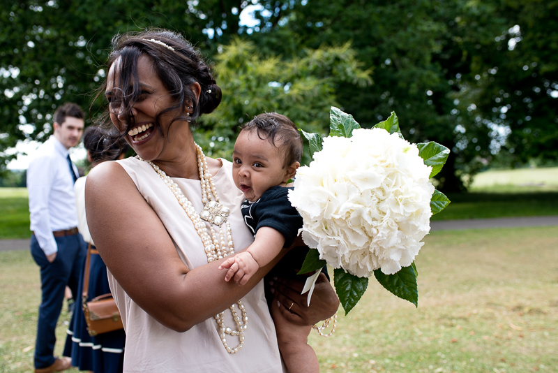 Bride with baby outside Merton Registry Office