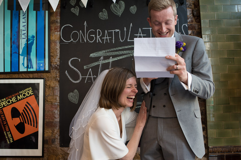 Bride and groom laugh and cry during speeches at The Londesborough in Stoke Newington