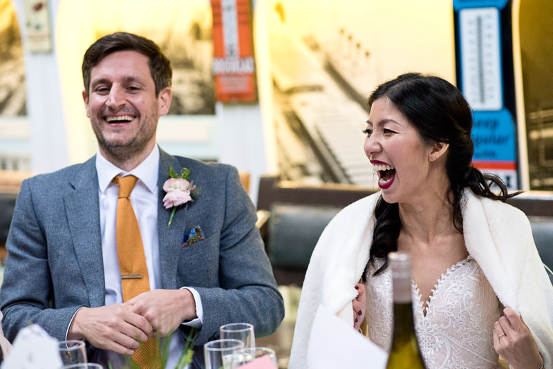 Bride and groom react to speeches at Fawley Hill wedding
