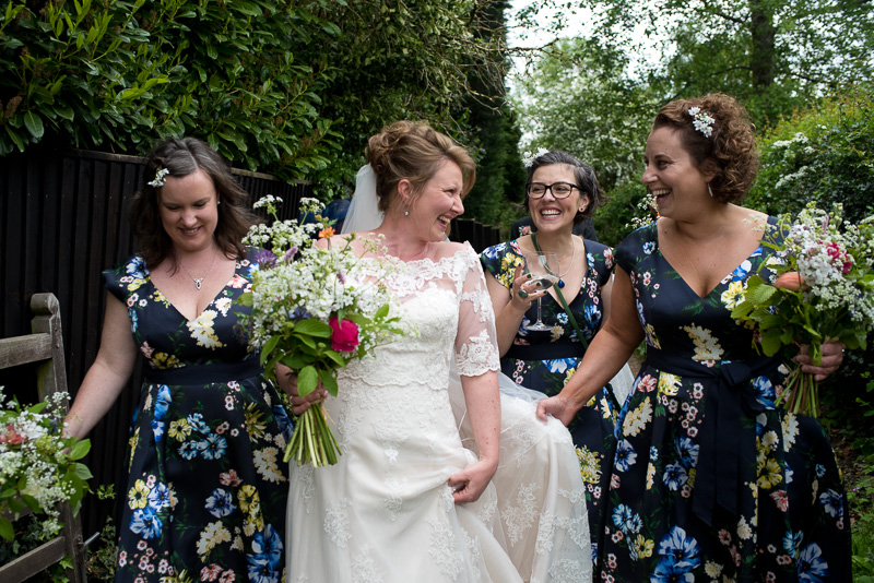 Bride with bridesmaids on way to yurt wedding at North Hill farm