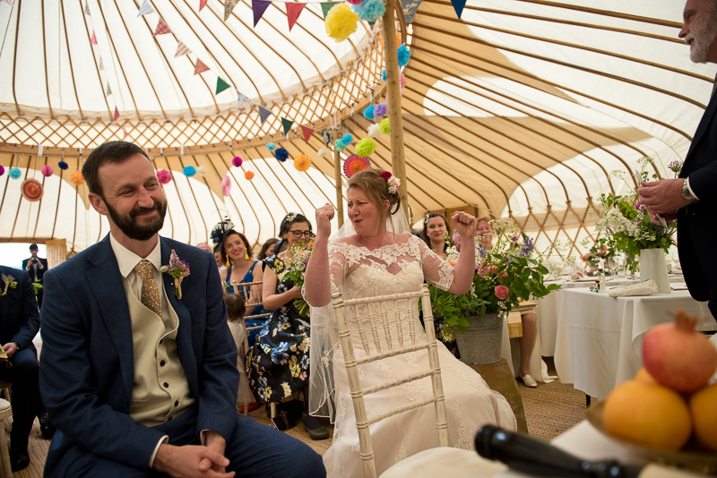 Bride and groom celebrate at yurt wedding at North Hill farm
