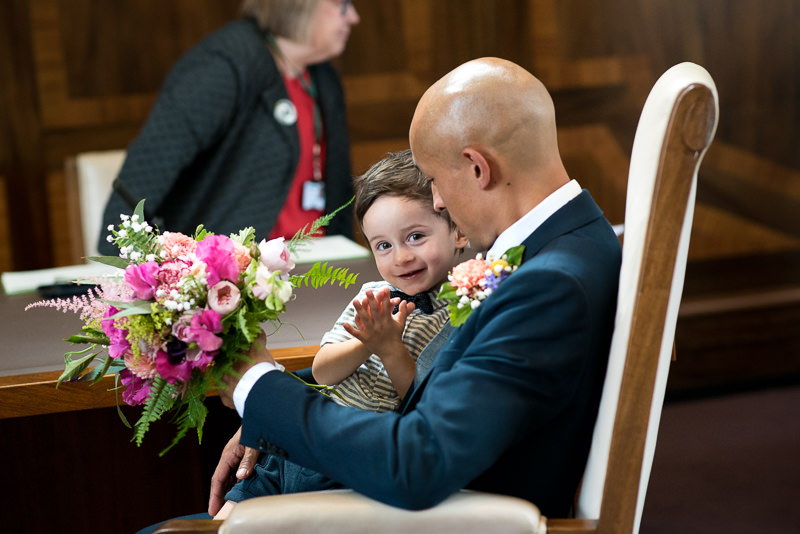 Groom and son during wedding ceremony in Stoke Newington