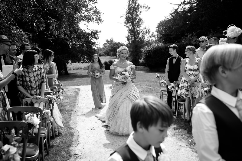 Bride walks up aisle at Chiddingstone Castle wedding