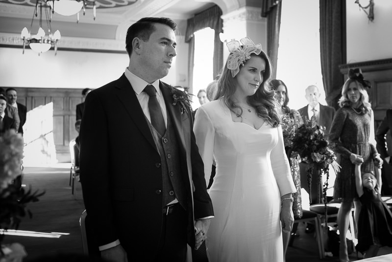Black and white photograph of wedding ceremony at Islington Town Hall