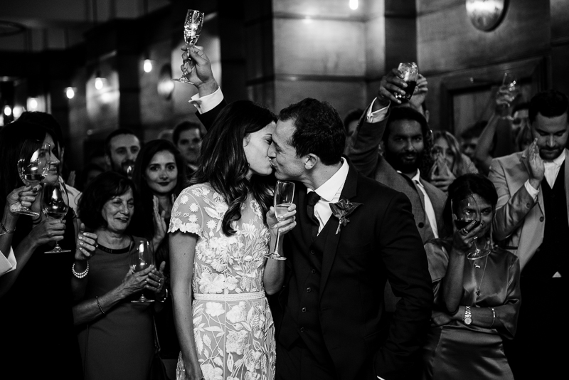 Bride and groom kiss at Town Hall Hotel wedding in Bethnal Green