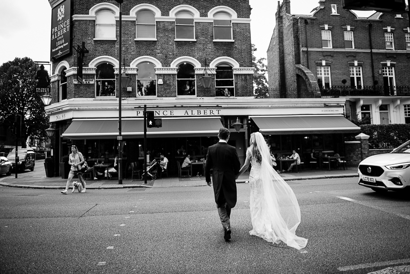 Bride and groom arrive at wedding reception at Prince Albert pub in Battersea