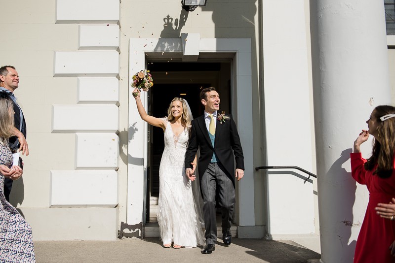 Bride and groom leave St Mary's Church Battersea after wedding