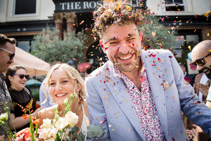Guests throw confetti on bride and groom at Rosendale Pub wedding